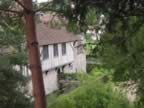 Our first glimpse of Ightham Mote through the trees (58kb)