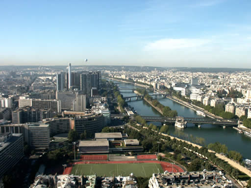 Good view from half way up La Tour Eiffel , note what appears to be a balloon just above the horizon